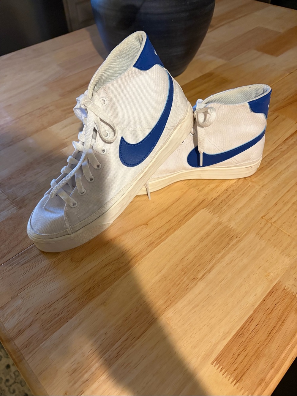 Nike White High-Top Sneakers with Blue Swoosh